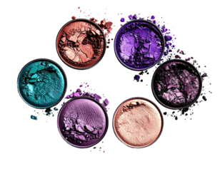 Colorful eyeshadow pots in a circle, scattered pigment