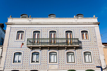 Traditional Portuguese Facade with Azulejos Tiles and Balcony in Alfama district, Lisbon