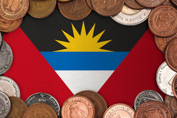 Coins on flag of Antigua and Barbuda trading investment business currency concept

