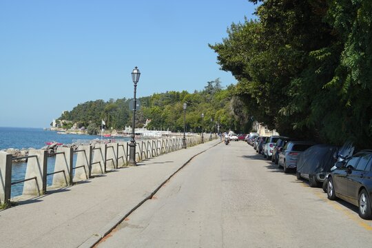 Travel italy triest trieste promenade along adriatic sea with parked cars