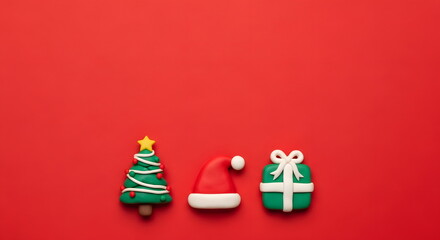 クリスマスのツリーとプレゼントとサンタ帽子のかわいいクレイアート背景