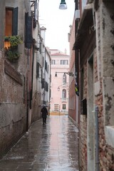 Travel italy venice person walking with umbrella in venice alley