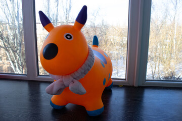 Inflatable Toy Dog Indoors Near Window, Children Play Concept