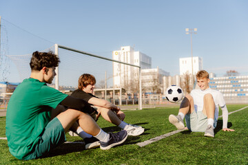 On a bright afternoon, three friends gather on a vibrant soccer field. Laughter fills the air as...