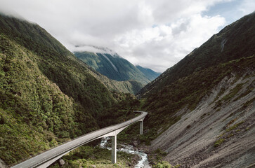 Curved Otira Viaduct Bridge Leading Through Dramatic Mountain Valley, New Zealand