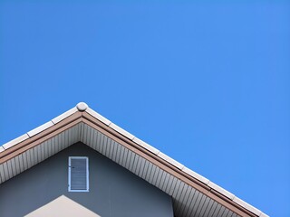 An architectural details of roof with a clear sky background. The simple design evokes a sense of minimalism and tranquility