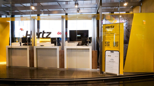 Rome, Italy - December 19, 2025: Interior of Roma Termini train station Hertz brand car rental agency office at Rome, Italy