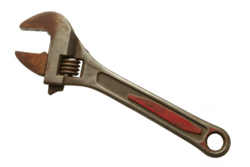 Rusty old adjustable wrench with red handle isolated on a transparent background