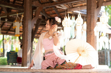 portrait of Asian woman wearing Thai northern traditional dress