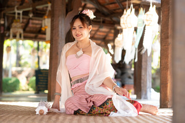 portrait of Asian woman wearing Thai northern traditional dress