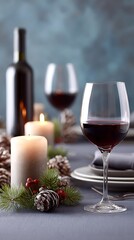 Festive holiday table decorated with wine and candles