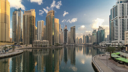 Fototapeta premium Dubai Marina towers and canal in Dubai night to day timelapse