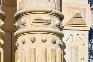 Ornate stone column with geometric patterns and architectural details
