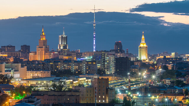 Ostankino tv tower and stalin skyscrapers near railway station day to night timelapse. Moscow, Russia