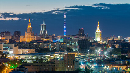 Fototapeta premium Ostankino tv tower and stalin skyscrapers near railway station day to night timelapse. Moscow, Russia