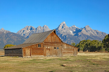 Historic barn with the Tetons in the background, Grand Teton National Park, Wyoming  USA
