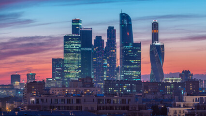 Naklejka premium Moscow International Business Center and Moscow urban skyline after sunset day to night timelapse