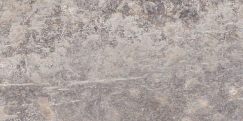 The rough surface of a stone slab with a concrete hue. Design for porcelain tiles