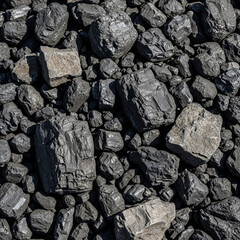 A large, dark pile of raw coal chunks, showcasing varied textures and sizes. This essential fossil fuel is a fundamental source for industrial energy and power