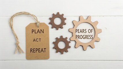 Cardboard gears illustrating business plan and process of progress