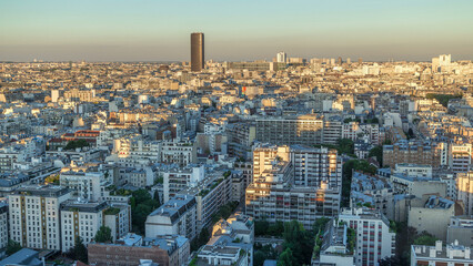Aerial panorama above many houses rooftops in a Paris timelapse