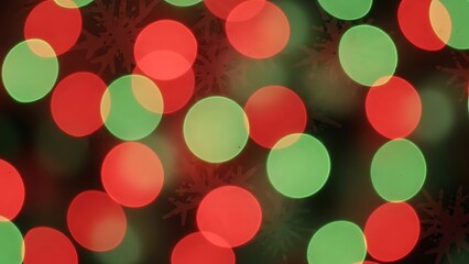 Vibrant Christmas lights in red and green hues create festive atmosphere