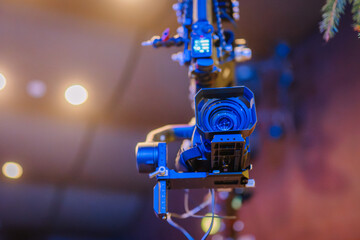 Professional camera mounted on a stabilizer, capturing high-quality footage in a studio environment, showcasing advanced technology and cinematic equipment for video production