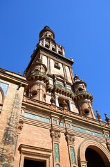 Fototapeta premium Top part of Torre Sur (south tower) at Plaza de Espana in Seville, Spain