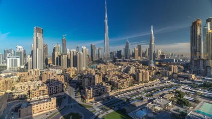 Bilder mit Rahmen Burj Khalifa Dubai Downtown skyline timelapse with Burj Khalifa and other towers during sunrise panoramic view from the top in Dubai  © HyperlapsePro