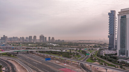 Fototapeta premium Aerial top view to Sheikh Zayed road near Dubai Marina and JLT timelapse, Dubai.
