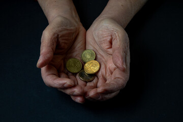 Old Hands Holding Small Change