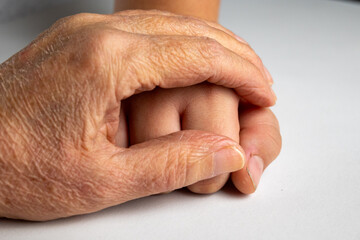 Elderly Hand Protecting Child Hand