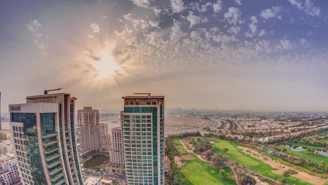 Sunrise over towers in Greens district aerial view from top timelapse.