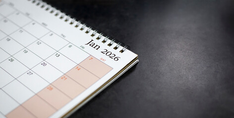 Calendar for monthly appointments and planning, Managing his business schedule, Hand marking dates...