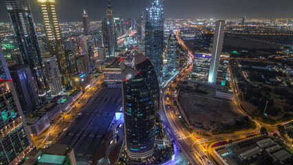 Skyline of the buildings of Sheikh Zayed Road and DIFC aerial day to night timelapse in Dubai, UAE.