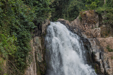 60-metre haew narok waterfall in khao yai national park thailand, cascading over rocky ledge