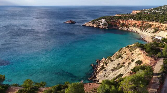 Mediterranean coast of Ibiza island in Spain, vacation on Balearic Islands, Cala Hort in Ibiza, drone shot of Ibiza coastline with turquoise sea 