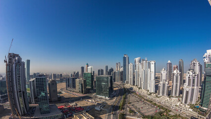 Obraz premium Panorama of Business bay Dubai night to day aerial timelapse.