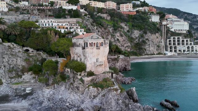 Drone Aerial view of Crestarella Tower and Vietri sul Mare town on Amalfi Coast, Campania, Italy