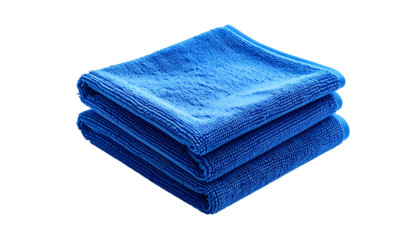 Stack of three blue microfiber cloths folded neatly. Black background highlights their texture