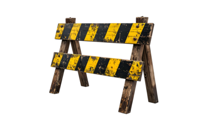 Weathered wooden construction barrier with yellow and black stripes, a warning sign