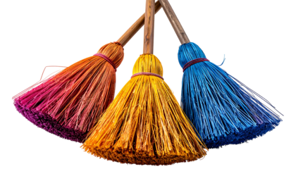 Three colorful straw brooms, each with a different hue, arranged in a semicircle against black