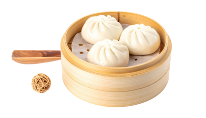 Steamed buns in bamboo steamer, small wood element nearby, isolated on black