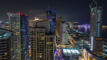 Naklejka premium JBR and Dubai marina after sunset aerial day to night timelapse