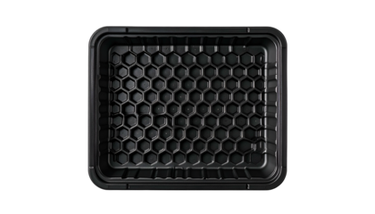 Overhead shot of a black plastic food tray, honeycomb pattern base, rectangular, empty
