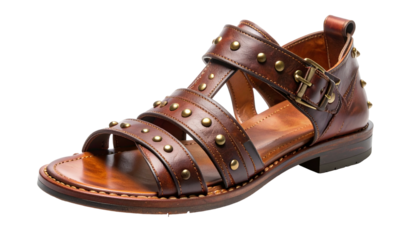 A detailed, isolated view of a brown leather gladiator sandal with studs and a buckle