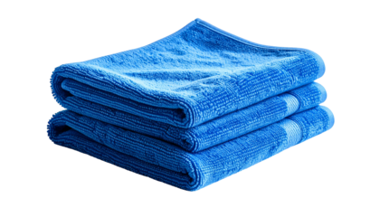 Stacked, folded blue terrycloth towels on a black background, suggesting cleanliness