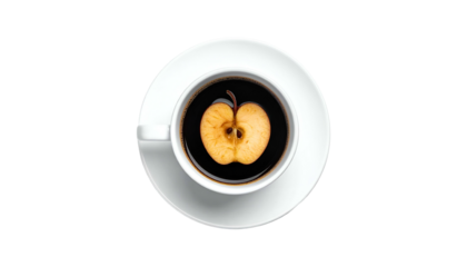 Overhead shot of coffee in a white cup, with an apple core floating within, on black