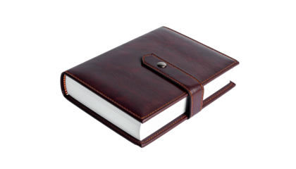 A closed, leather-bound notebook, with strap closure and white paper, isolated on black