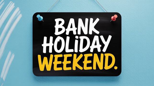 Bank holiday weekend text on black hanging sign with thumbtacks